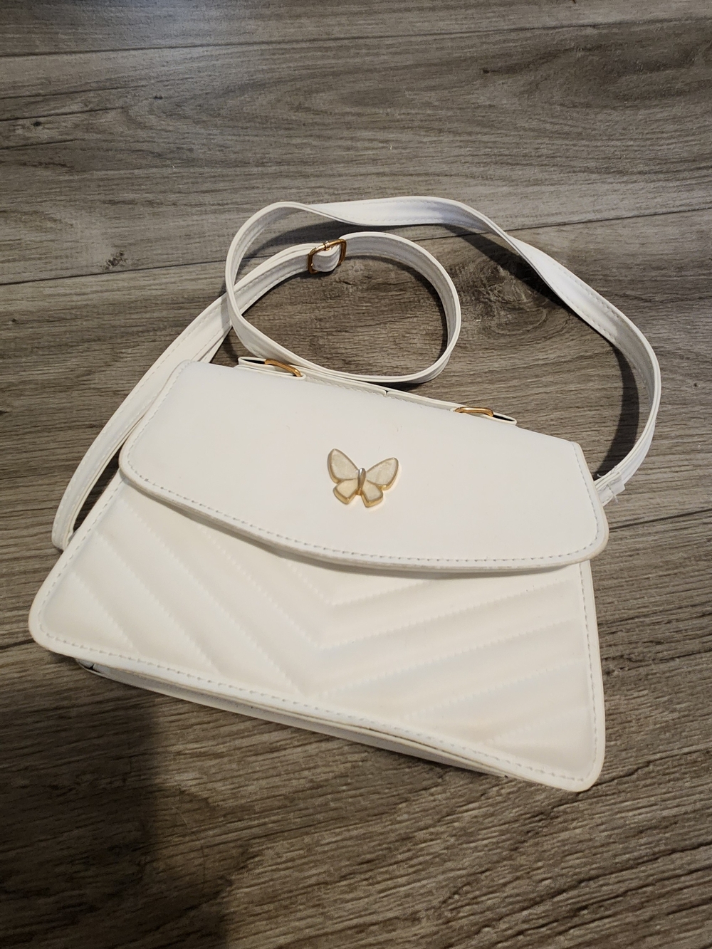 White Crossbody Bag with Gold Butterfly Accent